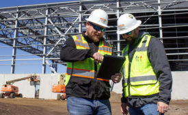 construction men with a tablet